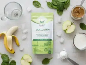 A top-down view of all the fresh ingredients needed for a Green Collagen Smoothie, arranged on a light wooden surface. The Simply Halal Collagen Peptides product bag is centered as the hero of the image. Surrounding the bag are fresh spinach leaves, a peeled banana, a halved green apple, a jar of almond butter, a measuring cup of almond milk, a blender jug ready for mixing, and scattered ice cubes. A measuring scoop filled with collagen powder is also visible.