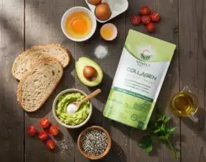 A top-down flat lay of all fresh ingredients for Avocado Toast Supreme on a rustic wooden table. The Simply Halal Collagen product bag is centered, surrounded by sliced whole-grain bread, a halved avocado, mashed avocado in a bowl, eggs, cherry tomatoes, and everything bagel seasoning, ready for preparation.